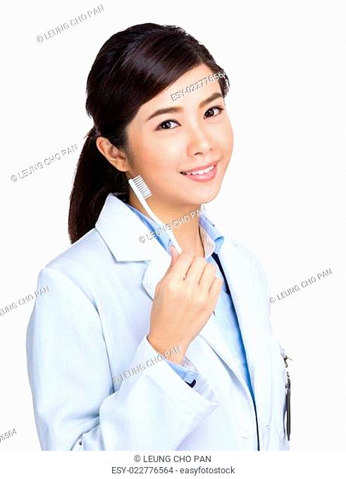 Female doctor with toothbrush
