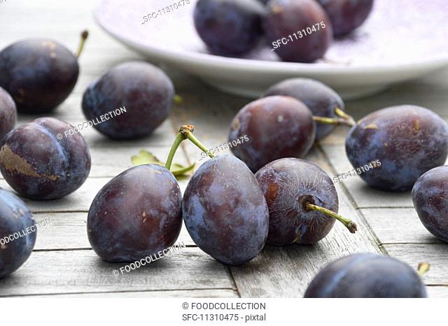 Plums on a wooden table