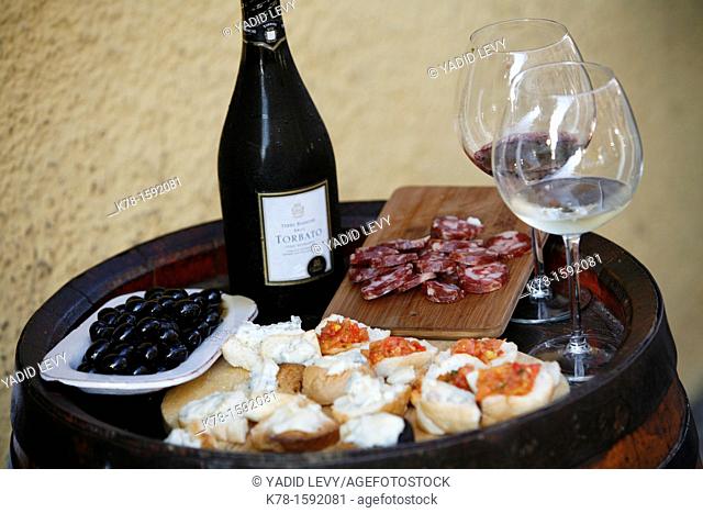 Plate of cheese, salami, olives and wine at Osteria Da Lio, La Maddalena, Sardinia, Italy