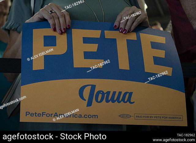 A supporter holds a campaign sign as 2020 Democratic Presidential hopeful, South Bend, Indiana Mayor, Pete Buttigieg speaks during a campaign event in...