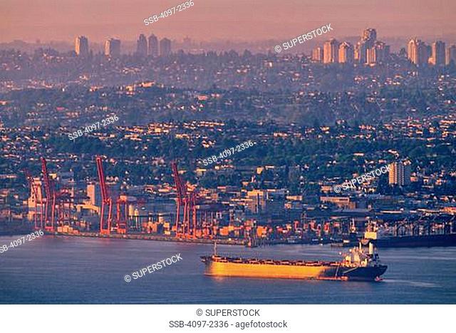 Container ship in the sea at sunset, Burrard Inlet, Vancouver, British Columbia, Canada