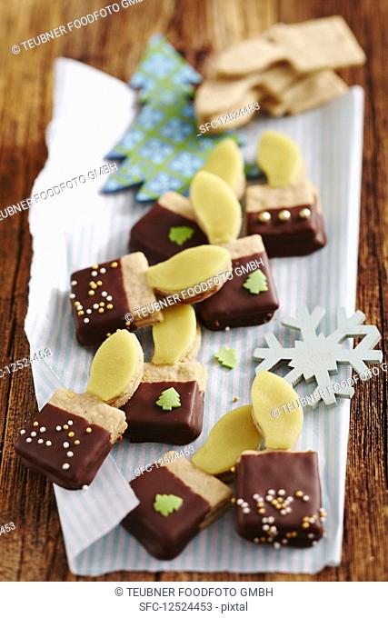 Christmas candle cookies with nut nougat and marzipan