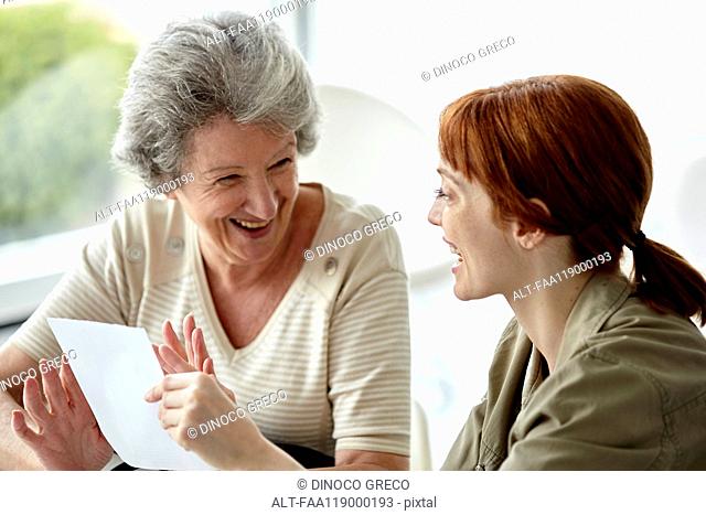 Mother and daughter holding prescription
