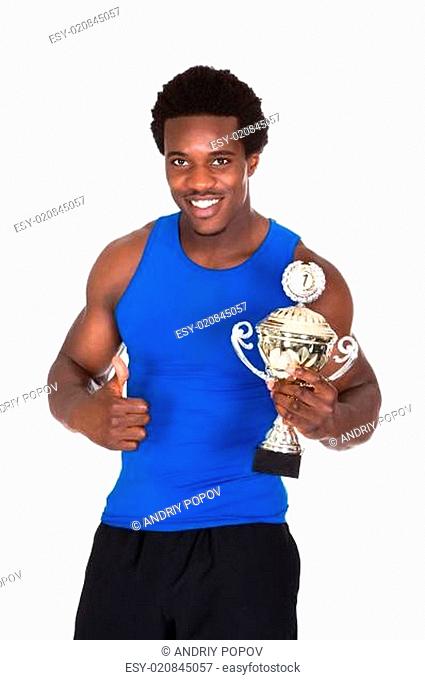 Happy African Athlete Holding Trophy