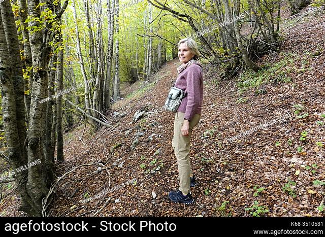 Woman in a beech tree forest nearItaly