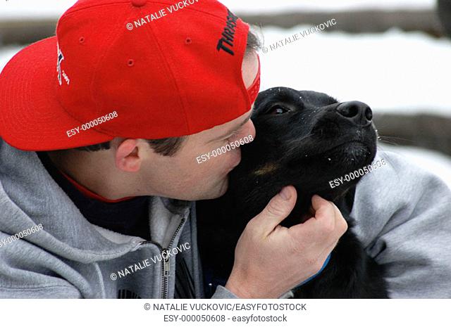 Man kissing Dog