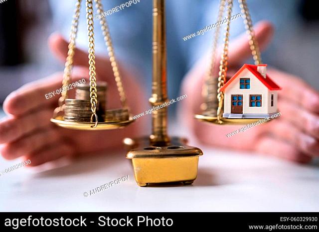 House And Asset Market Protection. Coins On Weight Scale