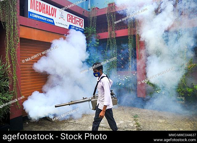 Sylhet city corporation workers are spraying pesticide at MEDHALOY School premises to eradicate Dengue mosquitoes with fogger machines
