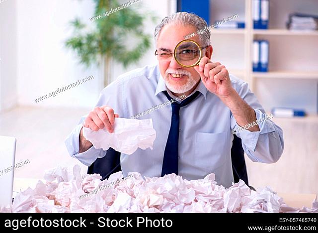 Businessman rejecting ideas with lots of papers