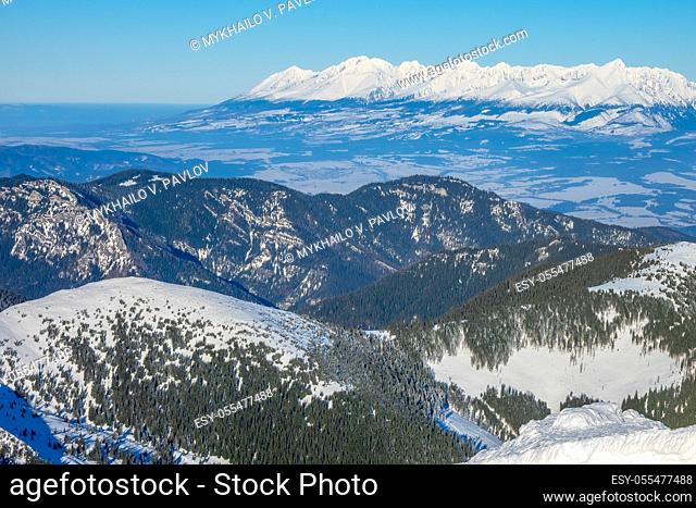 Winter Slovakia. Low Tatras. Snowy peaks in sunny weather and valleys forest