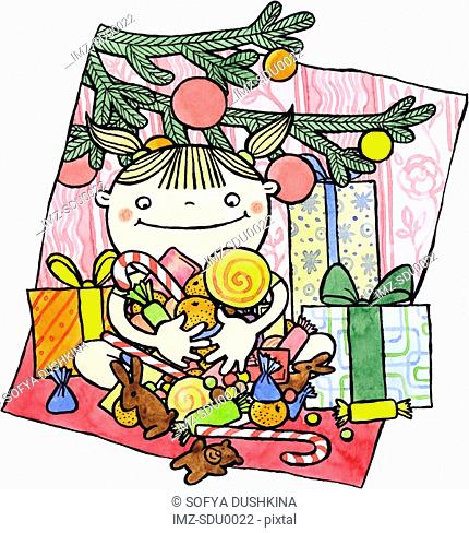 A girl sitting with gifts under the Christmas tree holding an armful of candy