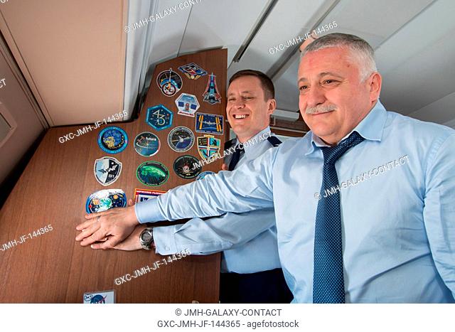 Aboard a Gagarin Cosmonaut Training Center aircraft, Expedition 51 crewmembers Jack Fischer of NASA (left) and Fyodor Yurchikhin of the Russian Federal Space...