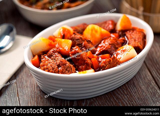 Hot stew with mushrooms and potatoes on a plate