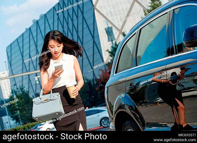 Beautiful car cell phone use business women