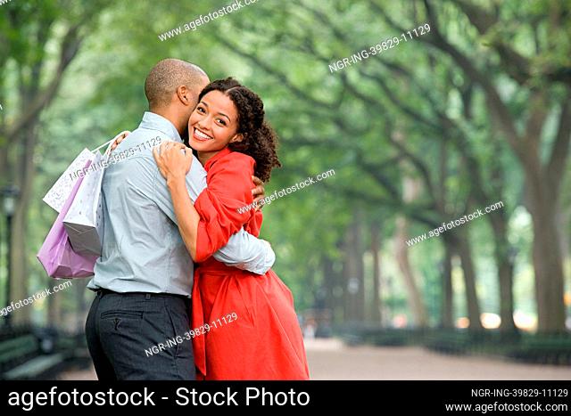 Woman hugging man