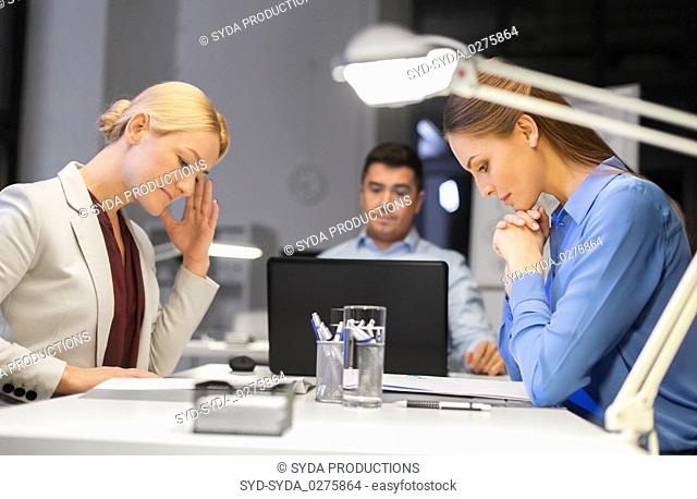 business team with laptop working late at office