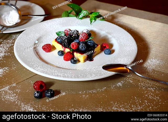 Lemon cake with fresh fruits and Icing sugar