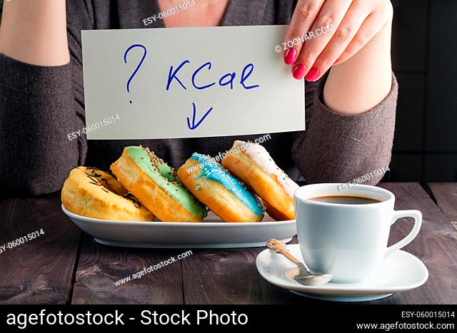 How much calories in sweet donuts, woman hold note with question