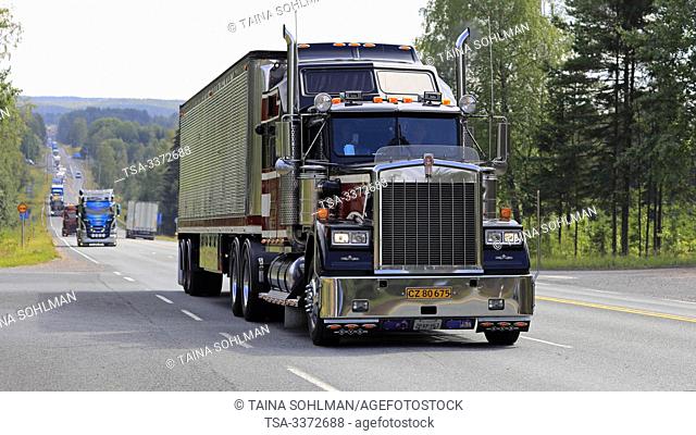 Ikaalinen, Finland. August 8, 2019. Kenworth W900 B 1987 Sundance Kid Saloon semi pulls Great Dane Trailer in truck convoy to Power Truck Show 2019