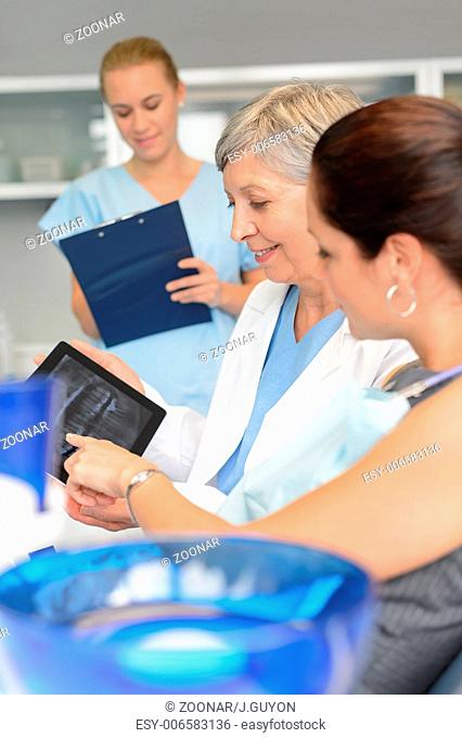 Dentist patient point xray tablet dental surgery