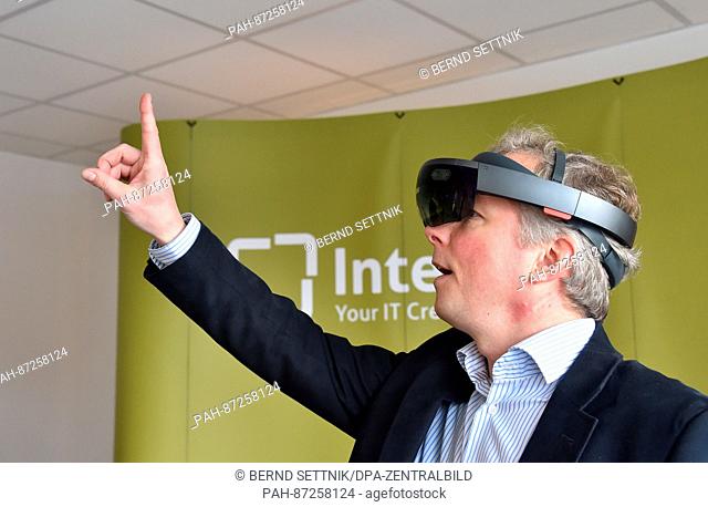 Sven Slazenger, CEO of the Interlake Systems GmbH, wears a HoloLens in Potsdam, Germany, 16 January 2017. The computer in the shape of glasses can integrate...