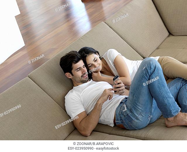 young couple making selfie together at home