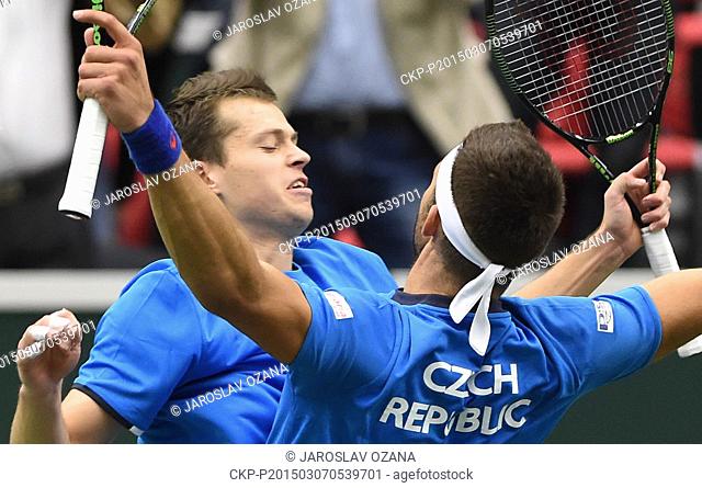 Adam Pavlasek (left) hugs his partner Jiri Vesely as they celebrate their victory in the Davis Cup World Group first round doubles tennis match against Samuel...