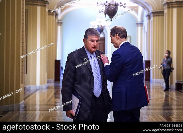United States Senator Joe Manchin III (Democrat of West Virginia), left, and United States Senator Ron Wyden (Democrat of Oregon), right