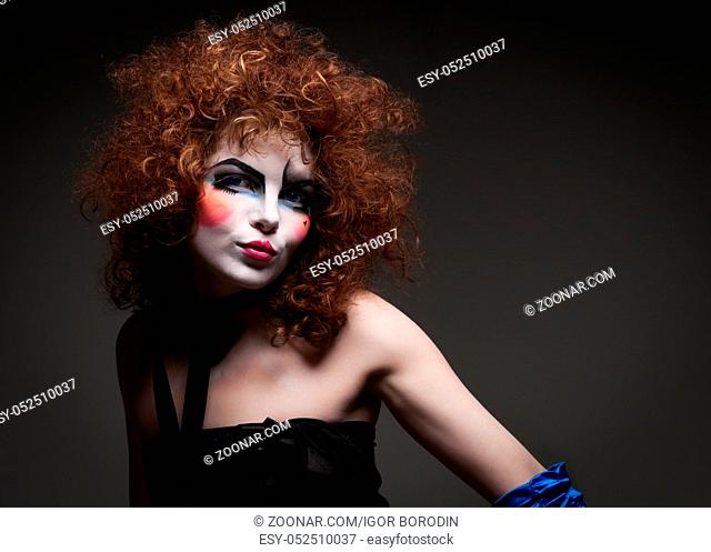 Woman mime with theatrical makeup. Studio shot