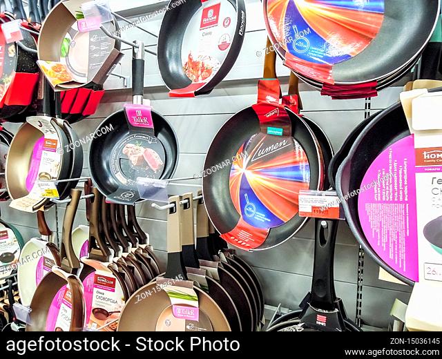 Samara, Russia - September 26, 2019: Various frying pans, cooking pots, utensils for sale on store shelf