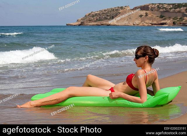 woman relaxing on an air mattress