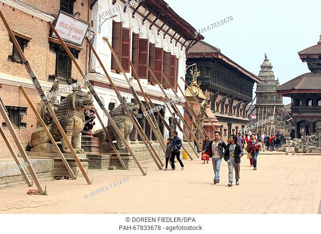 Locals and foreign tourists walk through the historic city of Bhaktapur, Nepal, 31 March 2016. Many old buildings in the country were destroyed in a massive...