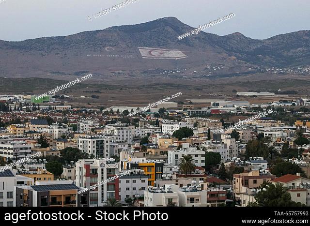 CYPRUS, NICOSIA - DECEMBER 14, 2023: Northern Nicosia faces the Kyrenia Mountains, the southern slope featuring a flag of the Turkish Republic of Northern...