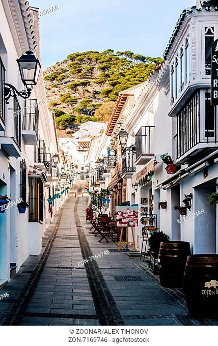 Charming whitewashed narrow street In Mijas