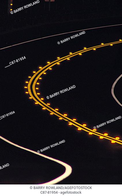 Night, Curve in road, yellow centerline and reflectors, white edge markings