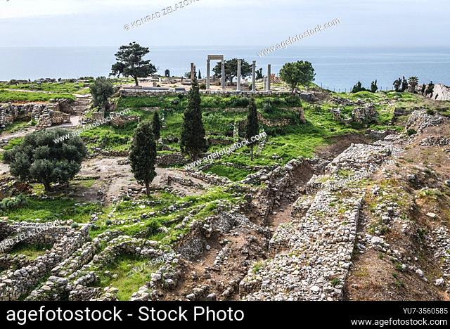 Remains of ancient temple and Roman columns on background next to crusader castle in Byblos, largest city in the Mount Lebanon Governorate of Lebanon