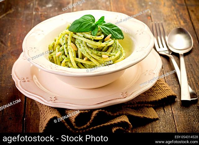 Delicious italian pasta with ligurian pesto and pine nuts