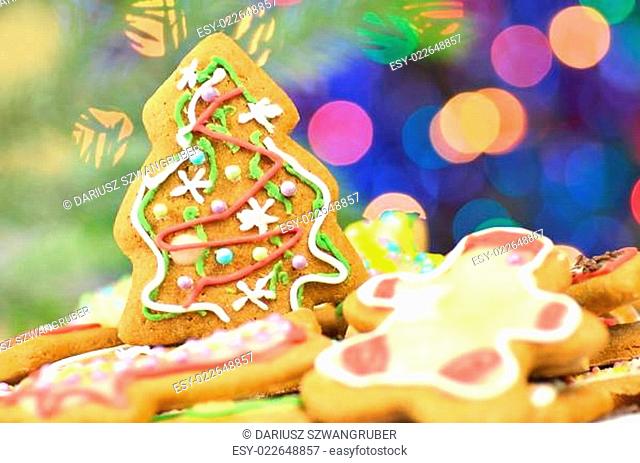 Delicious decorated Christmas cookies on bokeh background