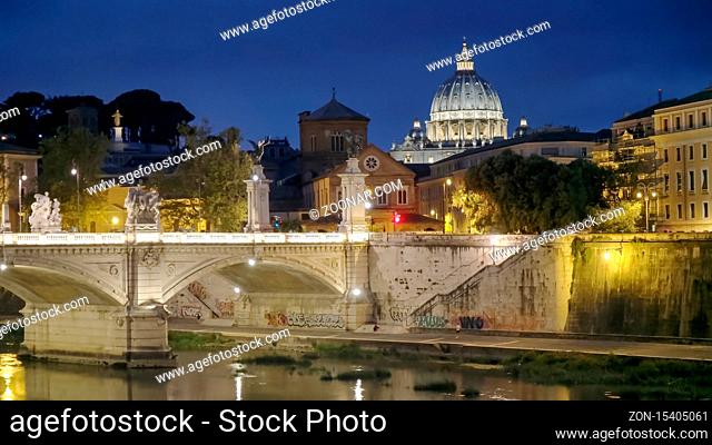 ROME, ITALY- SEPTEMBER, 6, 2016: night shot of the dome of st peter's basilica and tiber river in rome, italy