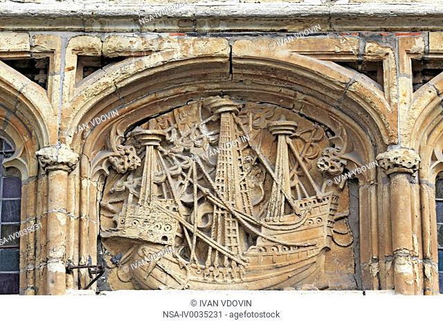 Old stone relief on facade of house with sail ship, Ghent, Belgium