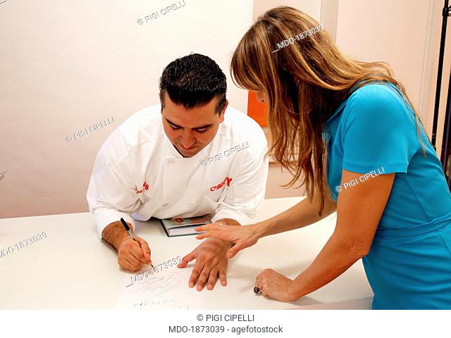 The TV presenter and journalist Benedetta Parodi posing for a photo shooting at Real Time studios with the chef and confectioner Buddy Valastro