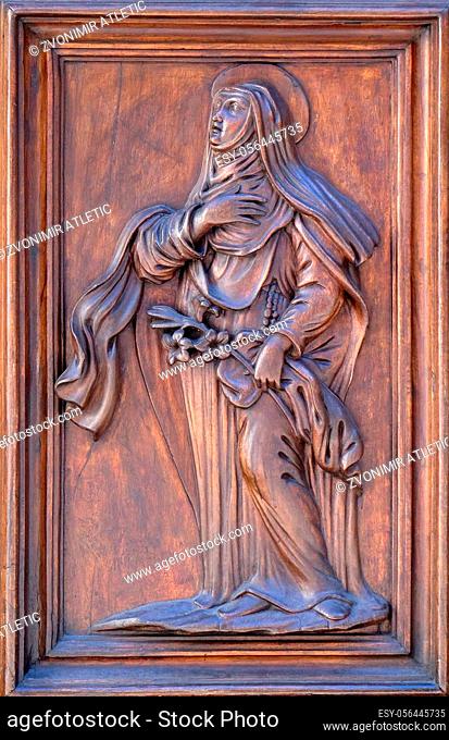 Saint, detail of te door of Church Santa Maria Maggiore in Florence, Tuscany, Italy