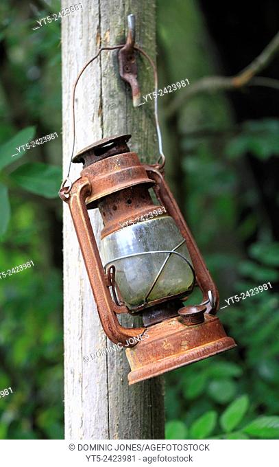 A rusty old lamp hangs forgotten at Vivian Quarry, Llanberis, Snowdonia, Wales, Europe