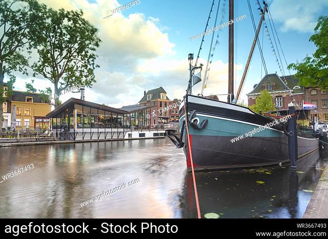 Netherlands, South Holland, Leiden, Sailboat moored in old harbor by Galgewater
