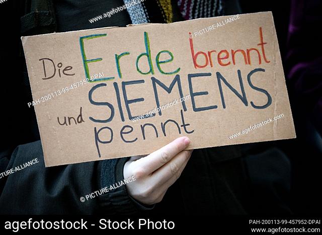 13 January 2020, Hamburg: Climate activists demonstrate during a Fridays for Future protest action in front of the Siemens office in Hamburg