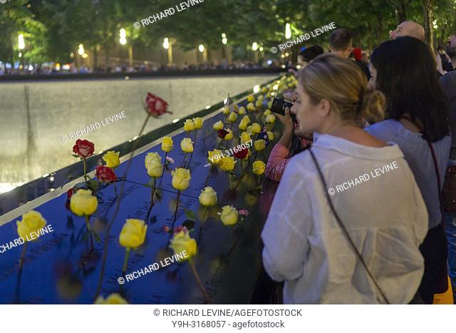 Flowers placed on the names of the victims at the 9/11 Memorial in New York on Tuesday, September 11, 2018 on the 17th anniversary of the September 11