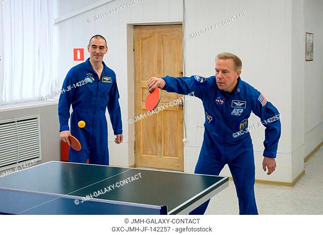 At the Cosmonaut Hotel crew quarters in Baikonur, Kazakhstan, Expedition 46-47 prime crewmember Tim Kopra of NASA (right) took a hand at a game of ping-pong Dec