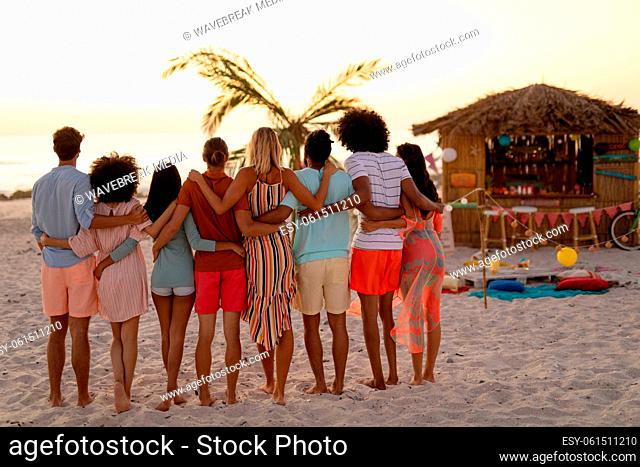 Multi-ethnic group of male and female having fun on the beach