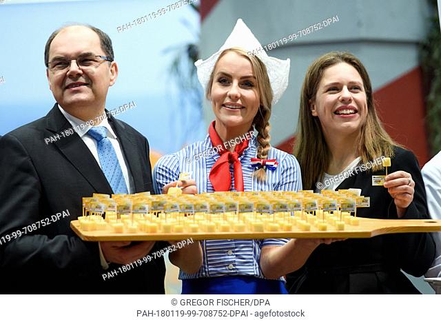 German Agriculture Minister Christian Schmidt (l-r) of the Christian Social Union (CSU), mascot of the Dutch Dairy Organisation (NZO) 'Miss Antje' and Dutch...