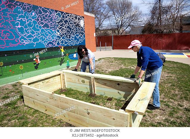Detroit, Michigan - Volunteers from Muslim, Jewish, and other groups clean, paint, and landscape at Schulze Academy for Technology and Arts